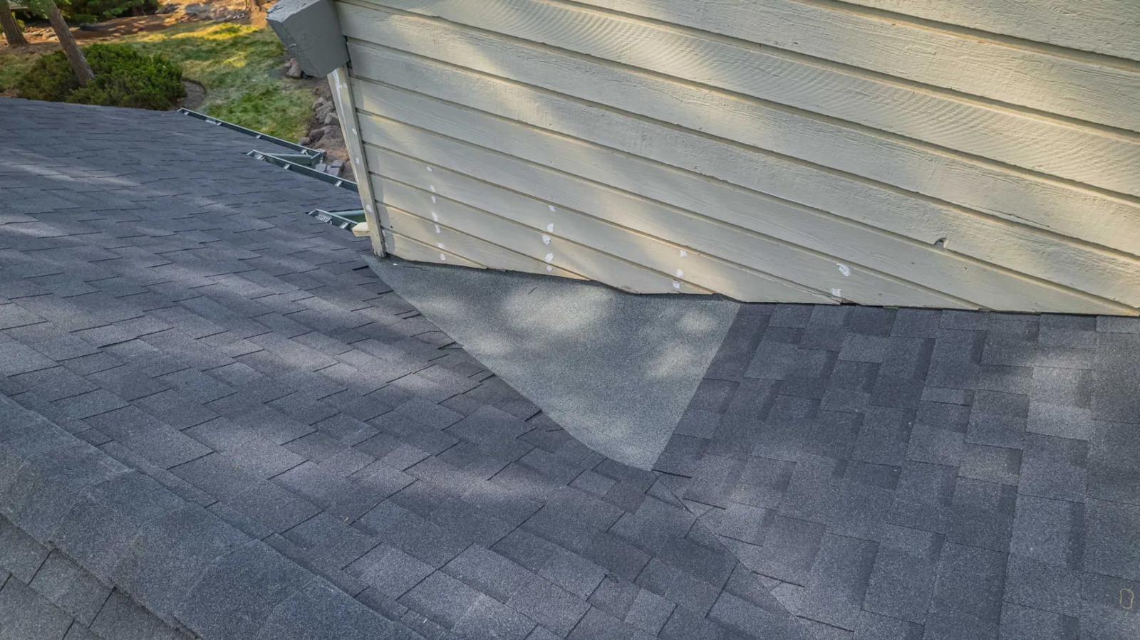 New composition shingles running into a clean roof valley
