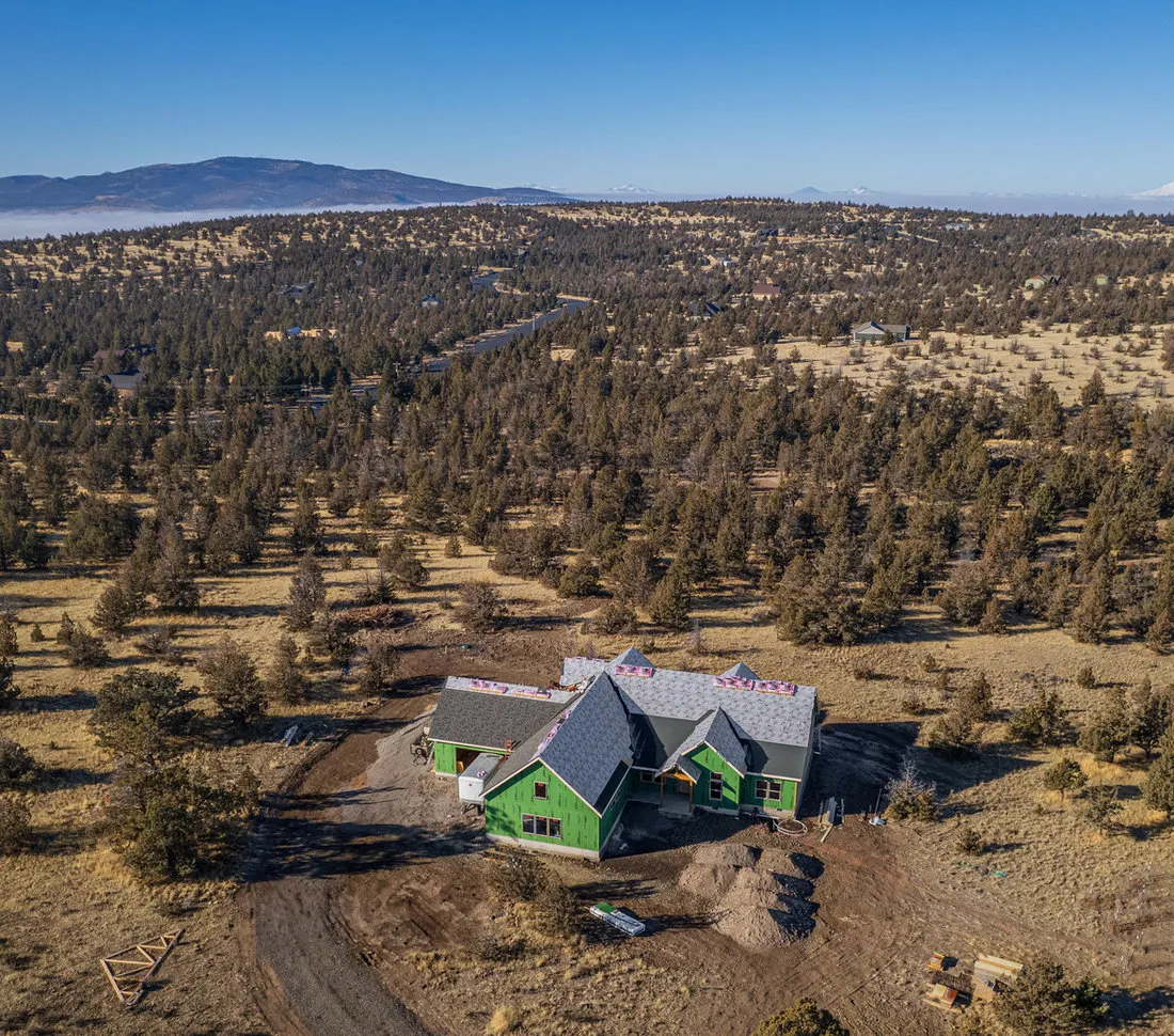 New home under construction in Central Oregon with a newly installed roof by Spey Roofing