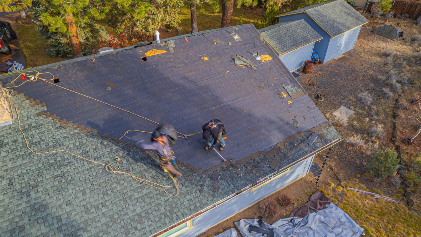 Underlayment rolled out over the prepared roof deck