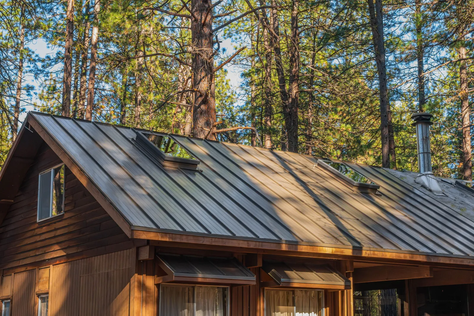 Standing seam metal roof on a home in the ponderosa pines near Bend, Oregon