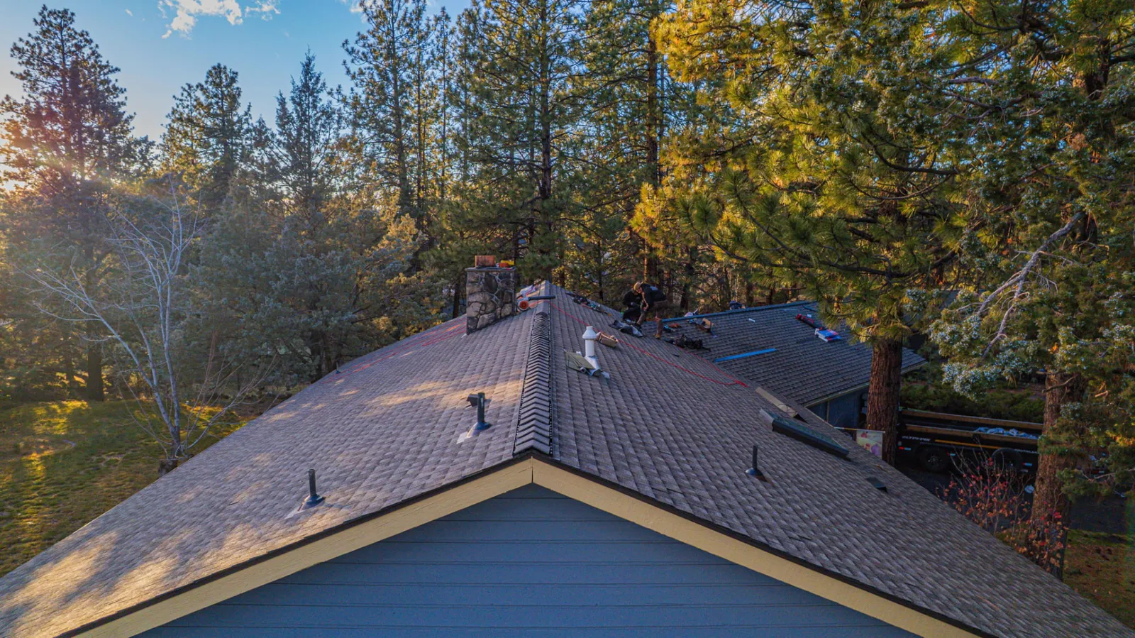 Newly installed composition shingle field with clean course lines on a Bend, Oregon home