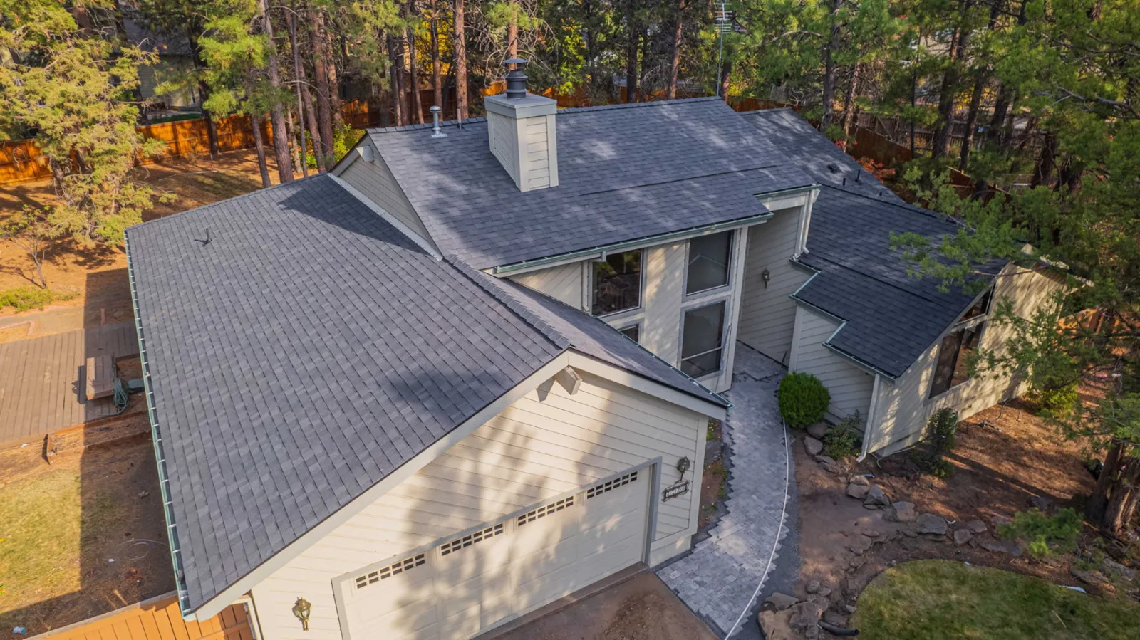 Side elevation of the finished composition roof and attached garage