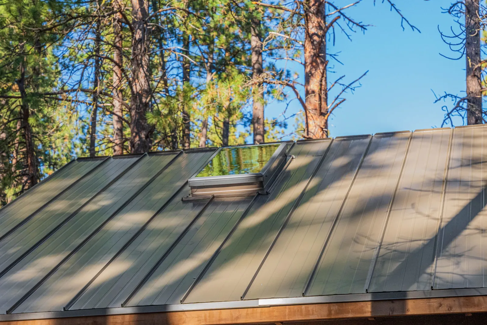 Close view of the standing seam panels and roof edge