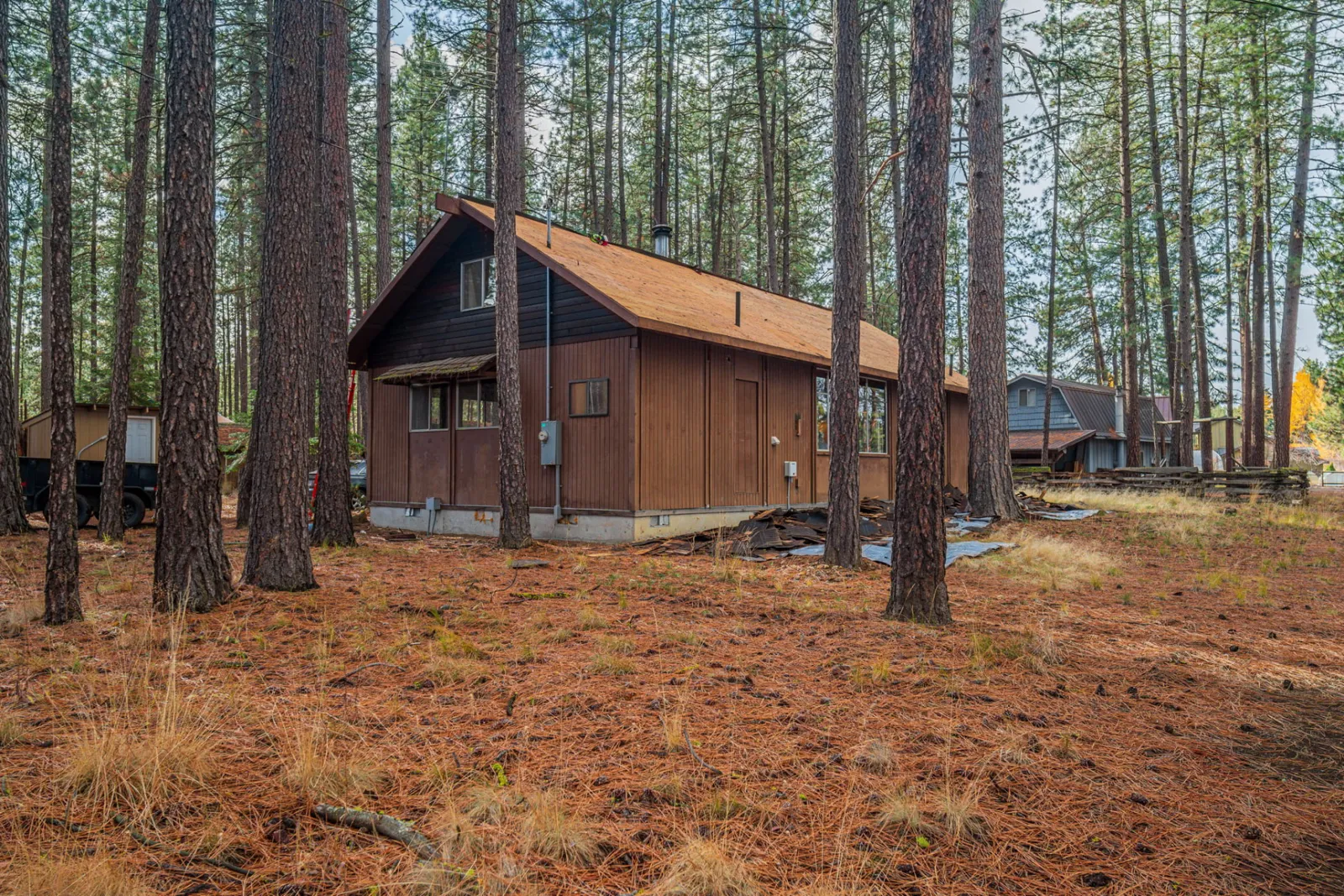 Exterior of the cedar-sided home with its finished metal roof