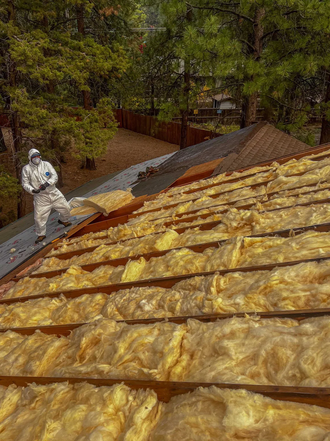 Full roof plane filled with fresh insulation before sheathing
