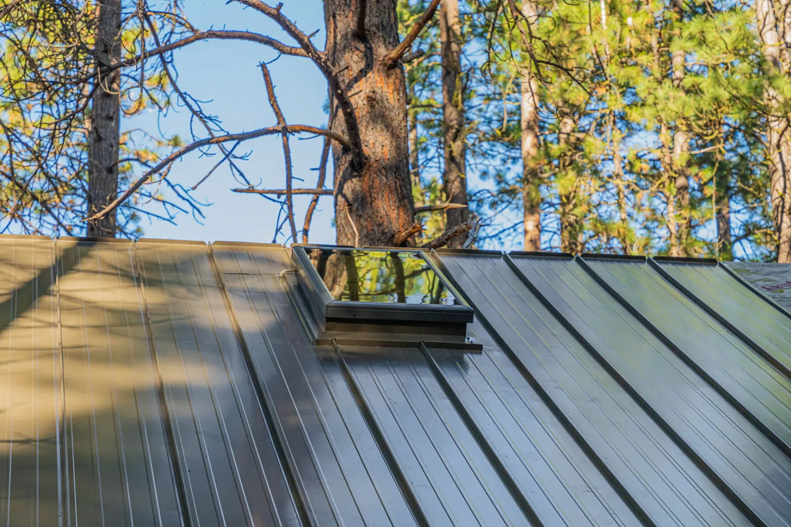 Skylight set into the finished standing seam metal roof